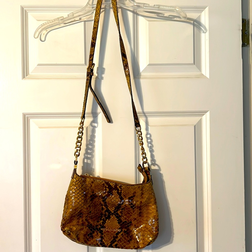 Michael Kors animal print purse with gold lettering